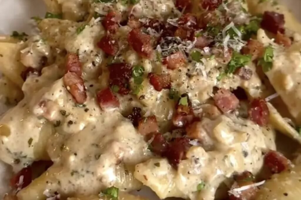 Creamy bacon parmesan pasta shells topped with crispy bacon, parmesan and parsley